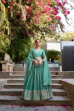 Doli - Plain With Weaving And Intricate Zari Work Border Teal Blue Lehenga Choli
